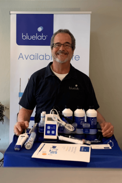 Bluelab sales rep showing a calibration station  